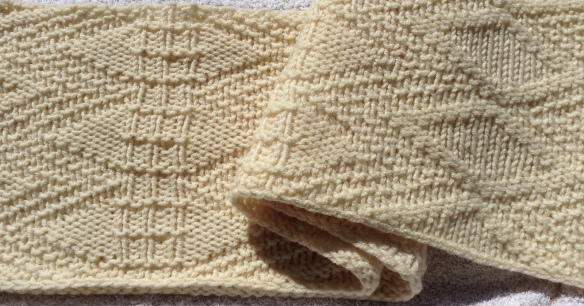 Here is the same cowl, finished, blocked and washed. What a difference a little soap and water make!