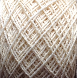 Soft and delicate, this Brogna yarn is a buttery straw color and plied in a special way to create a texture like that of a fine gold chain.